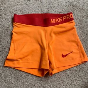 Bright orange Nike Pros